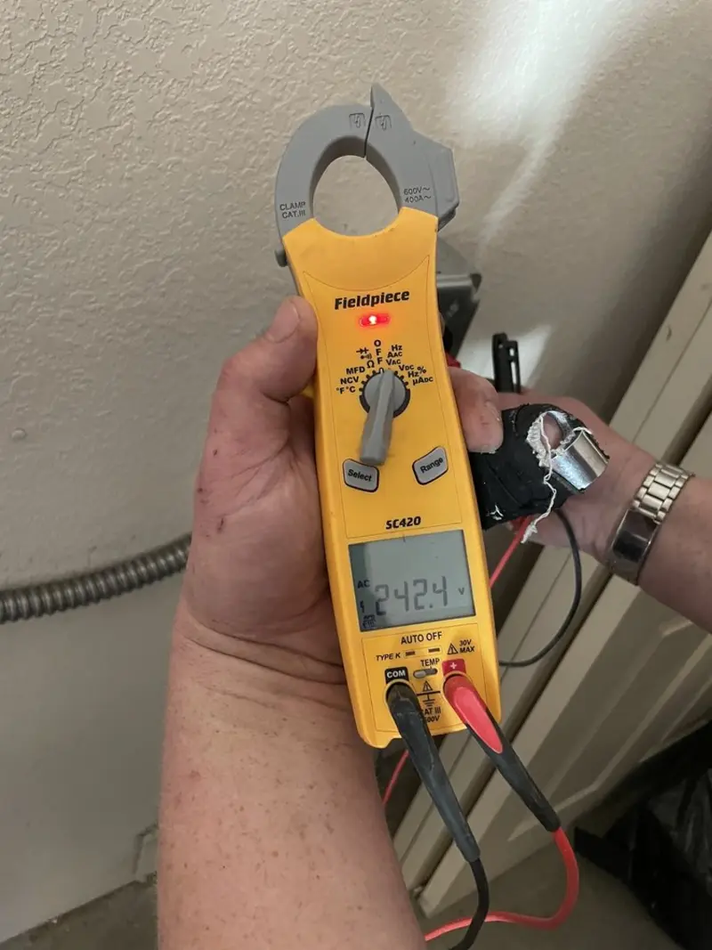 Voltage testing with clamp meter during Recessed Lighting Installation in Wentzville